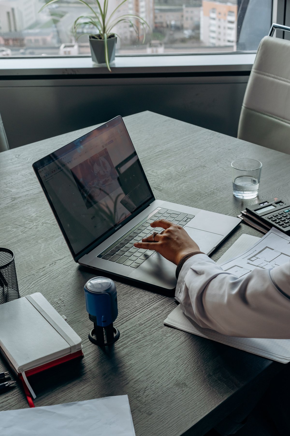 A Person Working with a Laptop